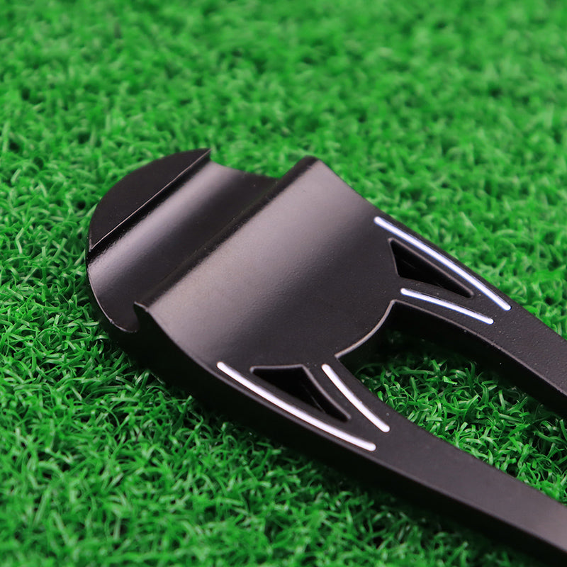 Golf Divot Repair Tool on green grass
