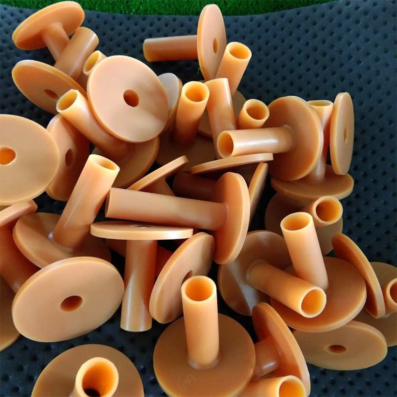 Collection of Golf Rubber Tee on a textured surface