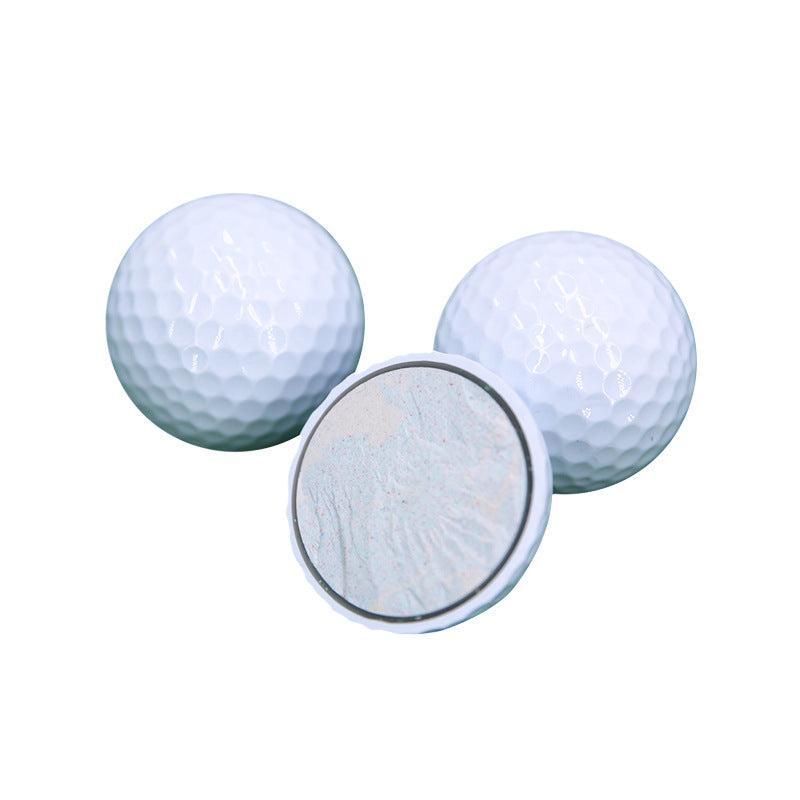 Two golf balls with a close-up of one ball's dimpled surface