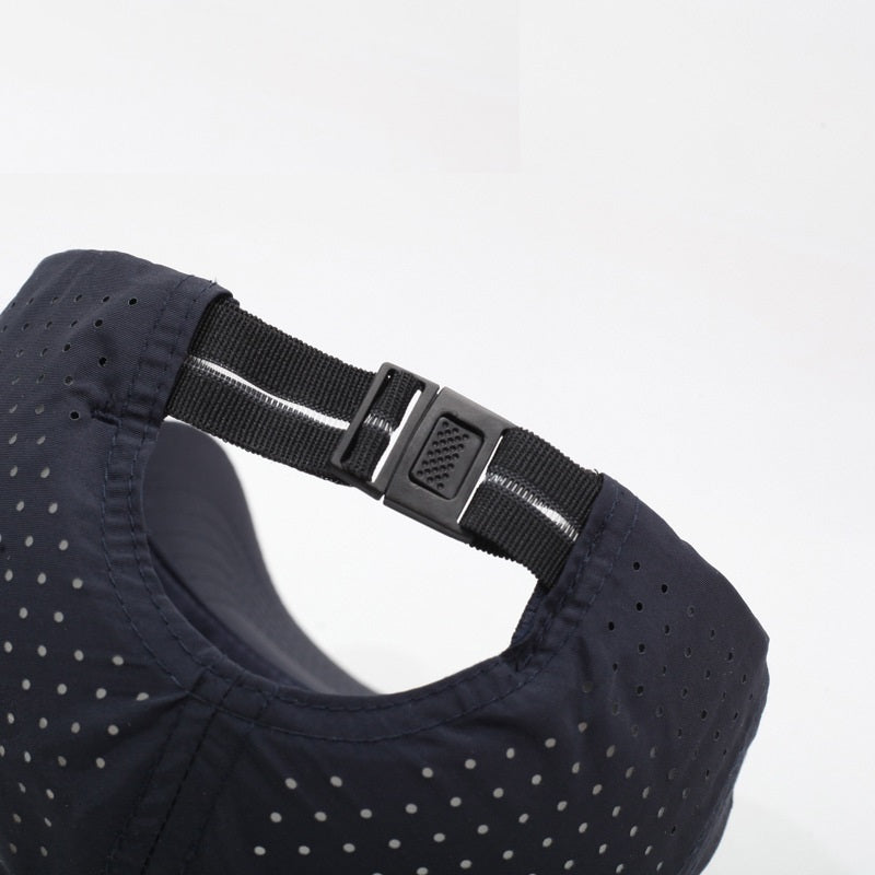 Navy blue cap with a black adjustable strap