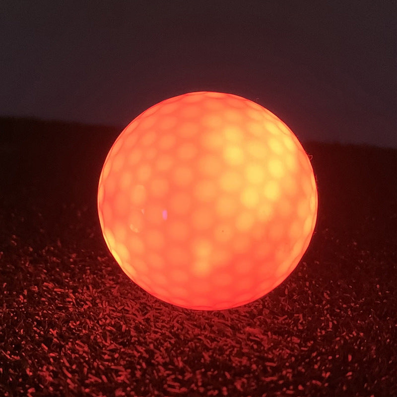 Glowing red golf ball