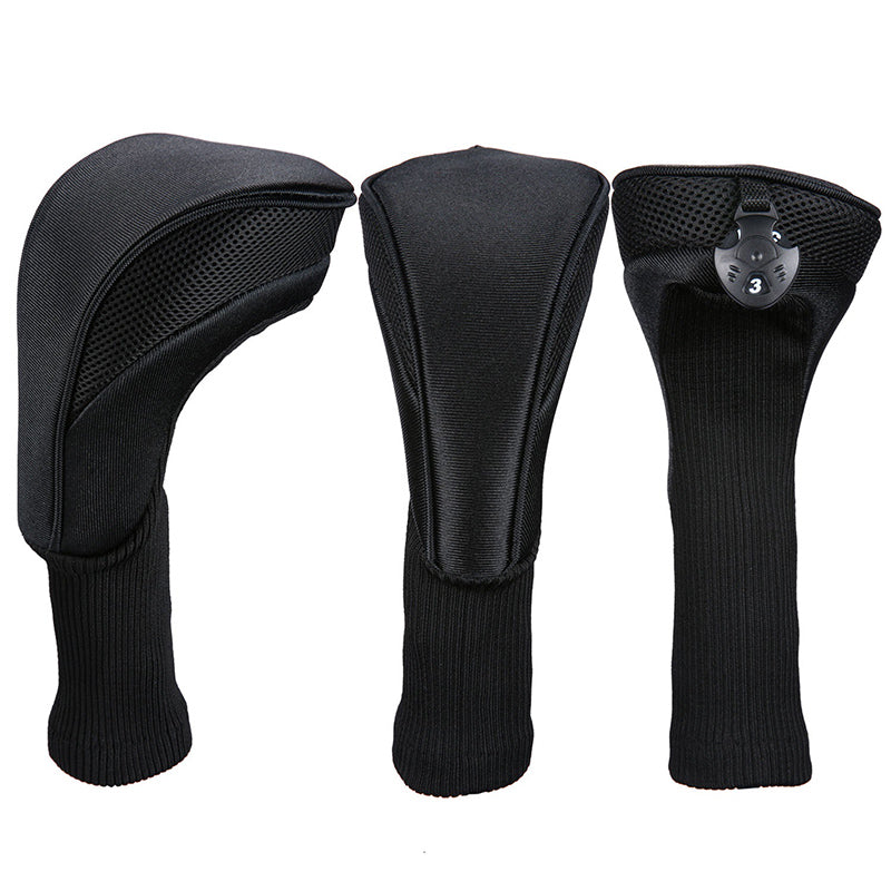 Three black golf club head covers on a white background