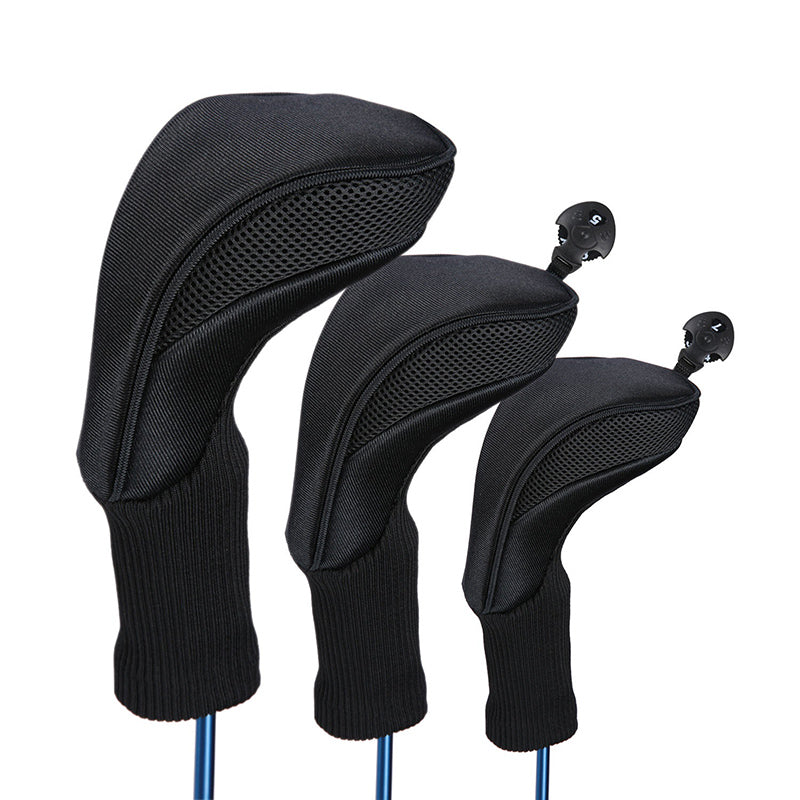 Three black golf club heads on a white background