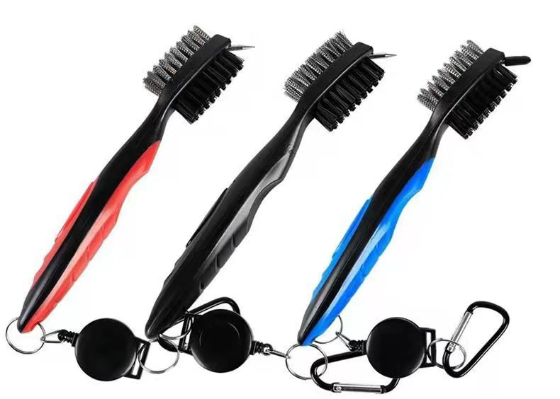 Three black cleaning brushes with red, blue, and black handles 