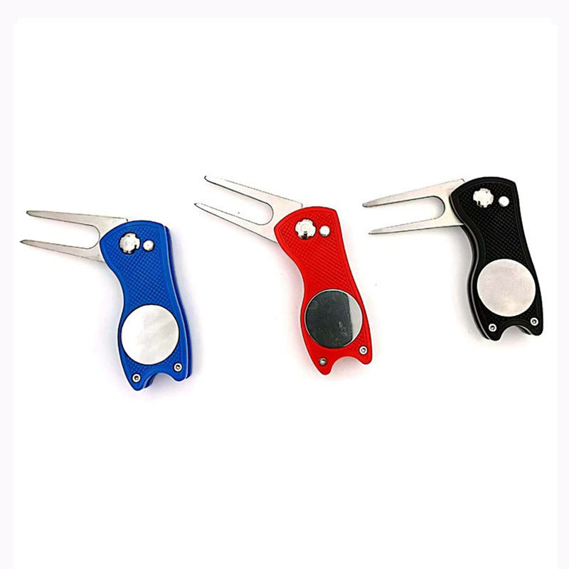 Three golf divots with blue, red, and black handles 