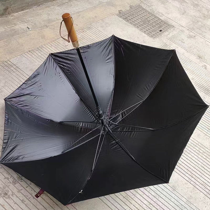 Black umbrella with a wooden handle 