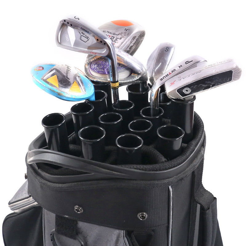 Golf clubs and golf tubes in a black golf bag 