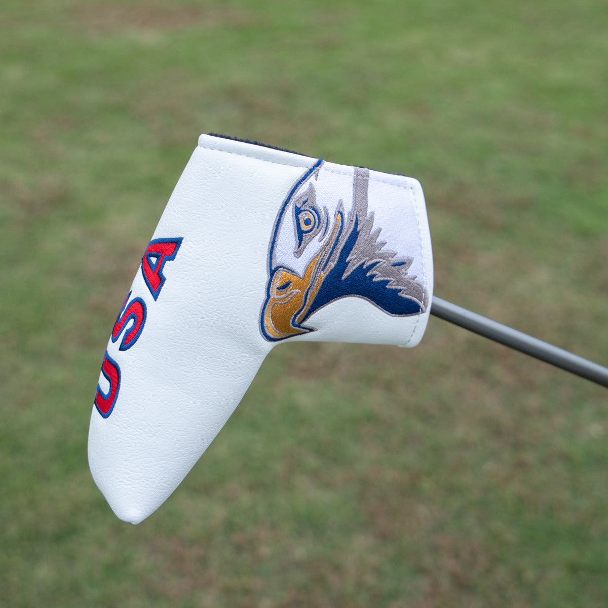 Golf club head cover with a design 
