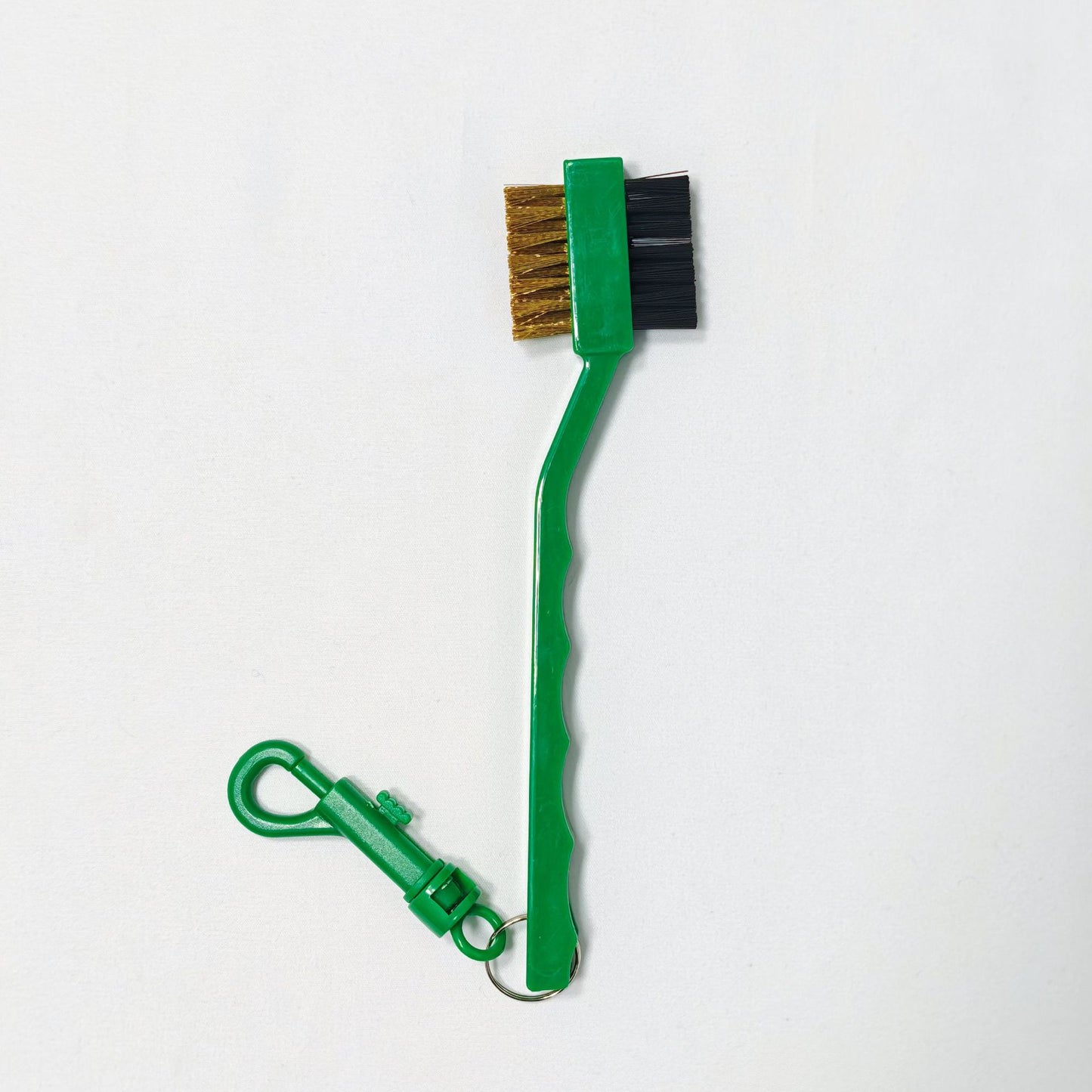 Green brush with a clip 