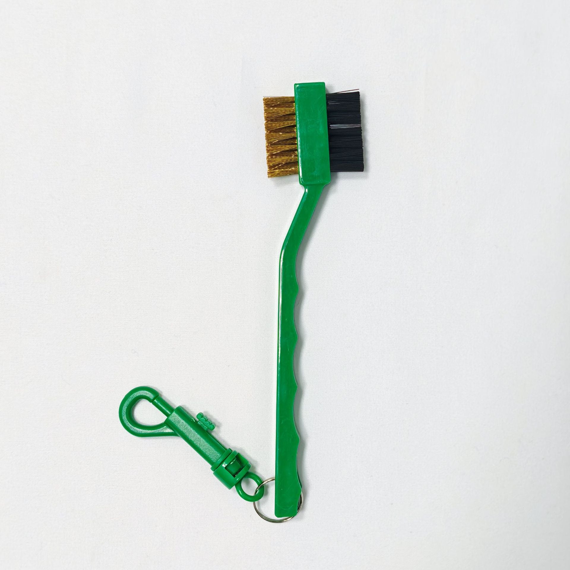 Green brush with a clip 