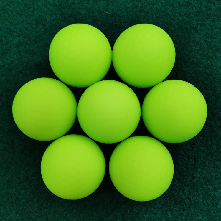 Green golf balls