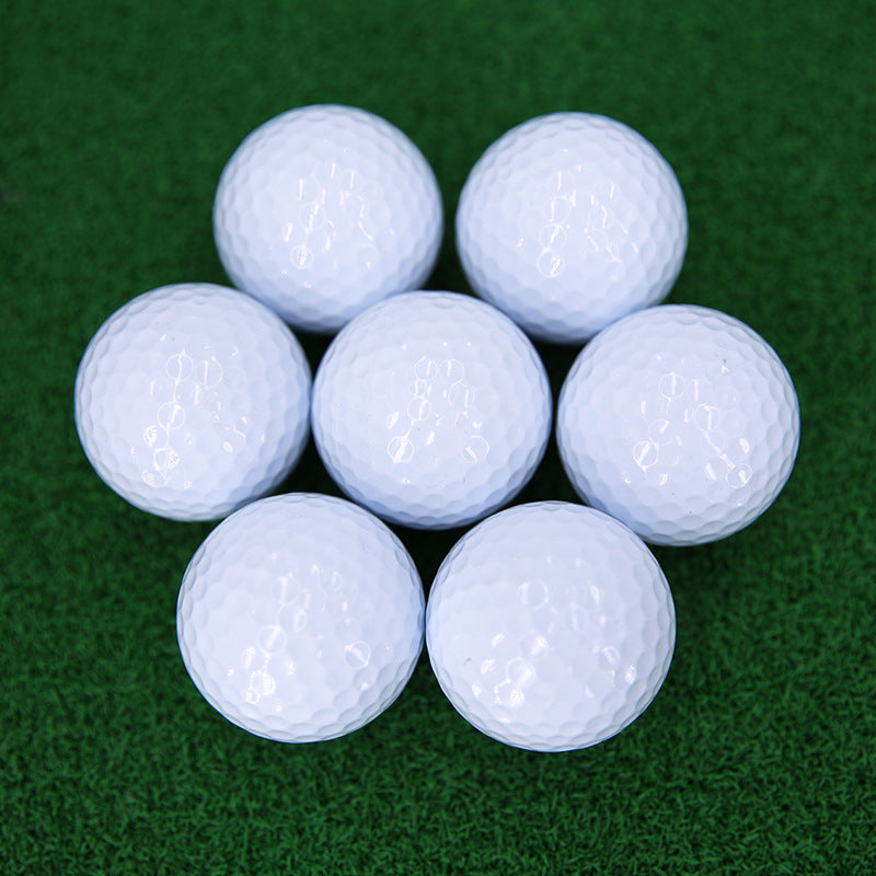 Nine white golf balls 