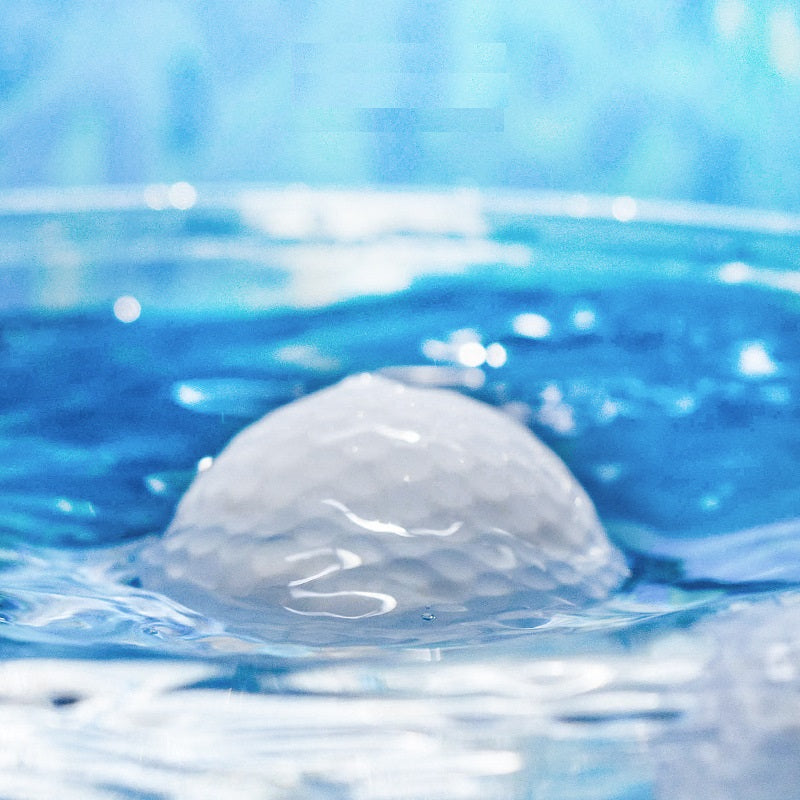  golf balls floating on  water