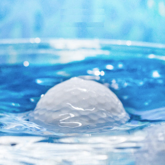  golf balls floating on  water