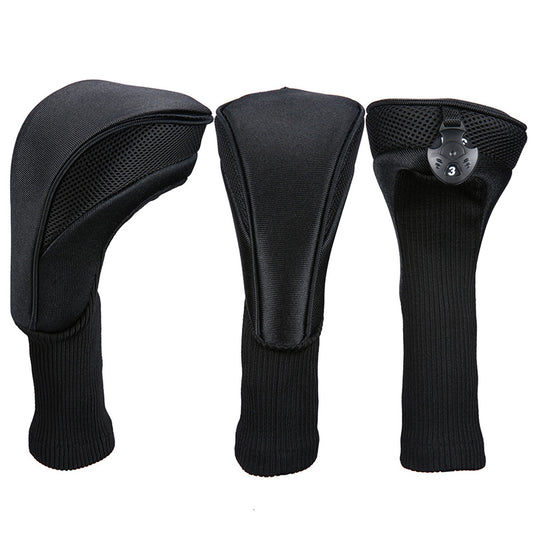 Three black golf club head covers on a white background