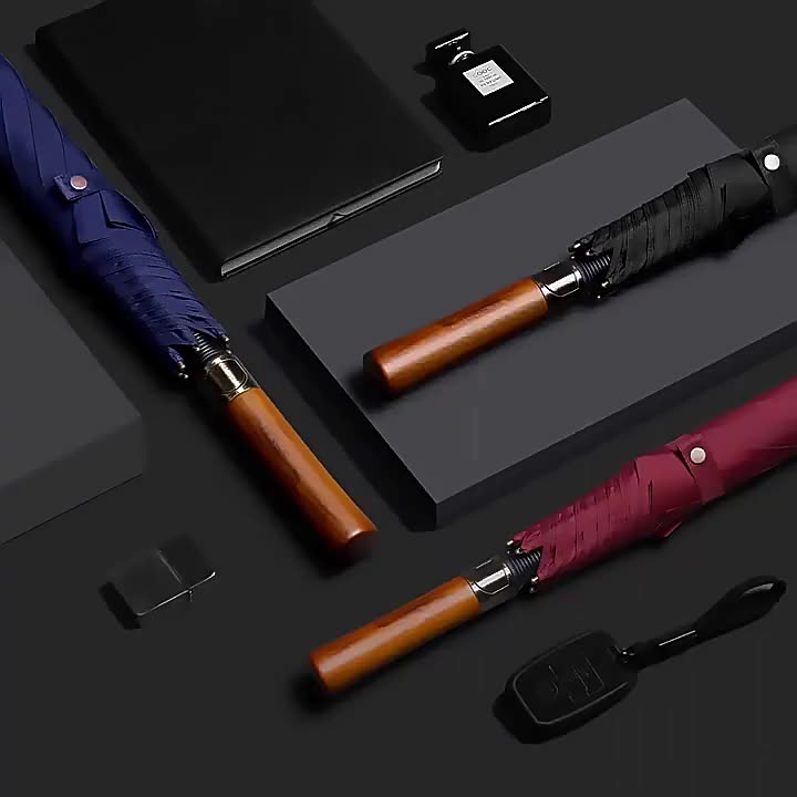 Collection of umbrellas with wooden handles 