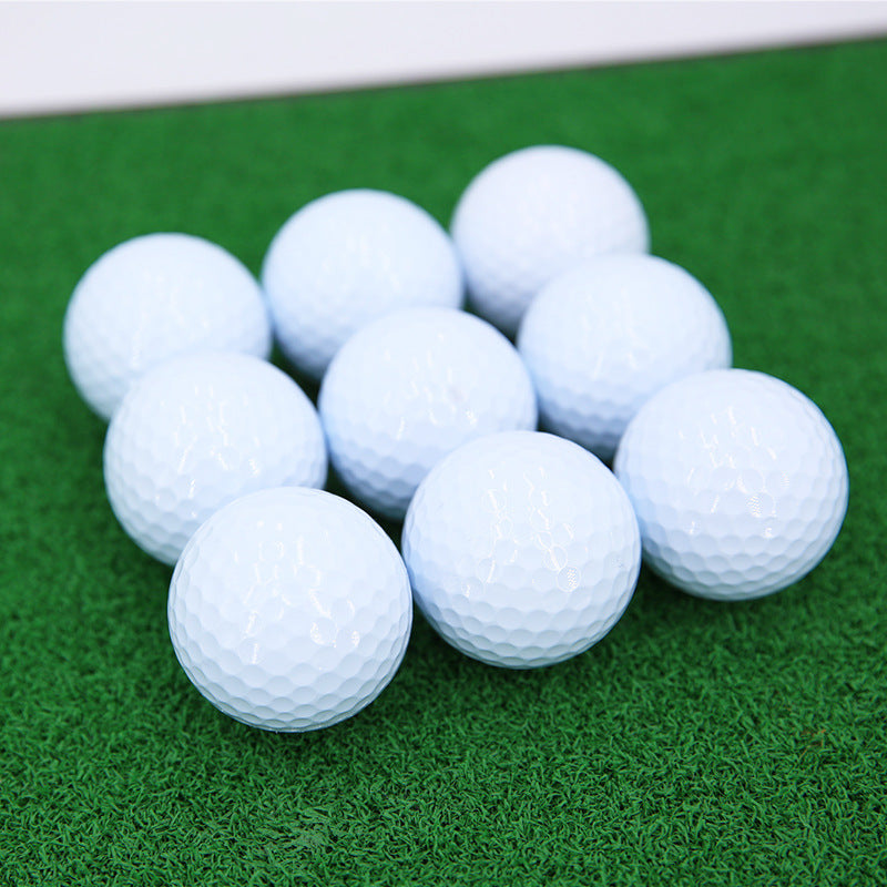 Stack of white golf balls 